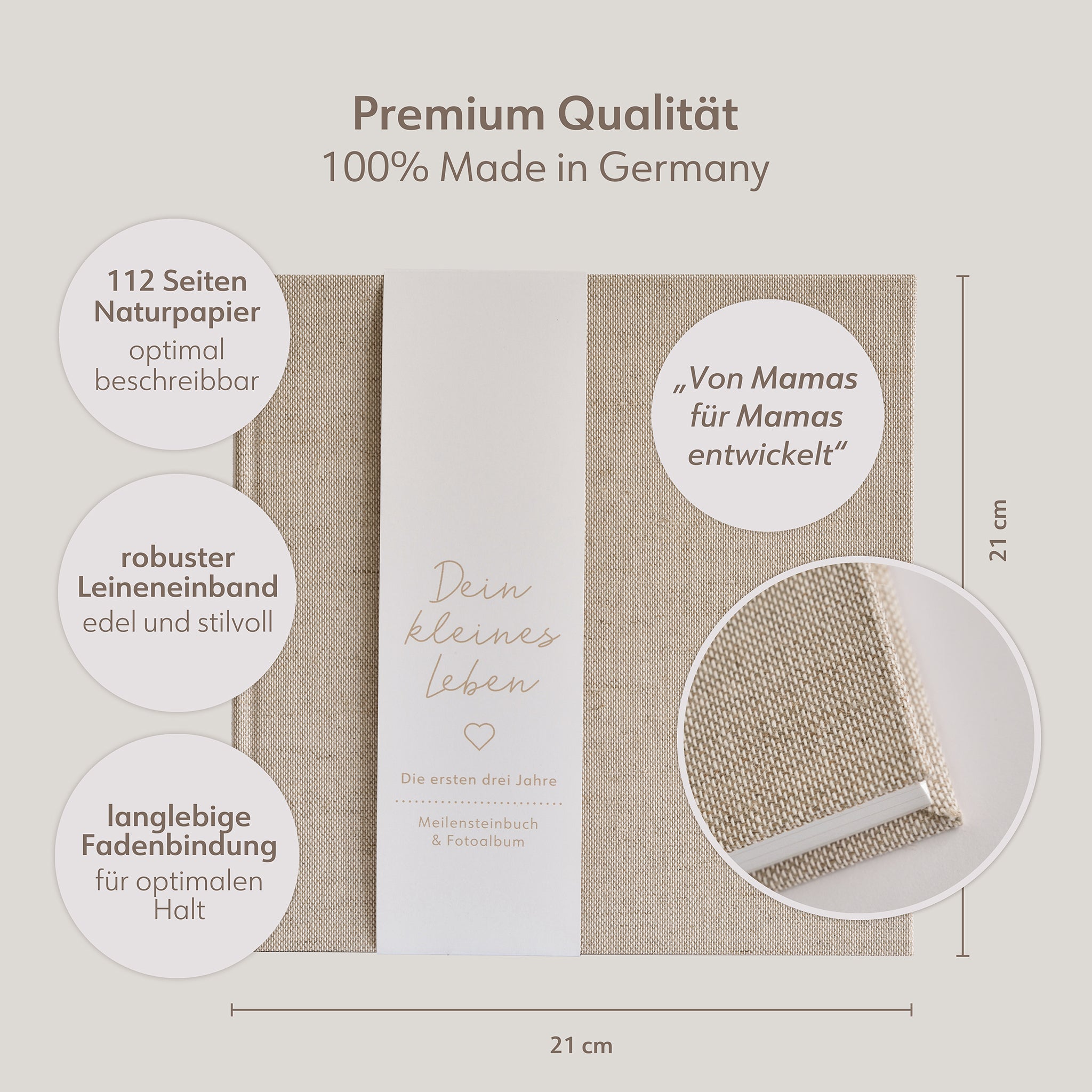 Babybuch aus Leinenstoff mit Papierbanderole mit der Aufschrift "Dein kleines Leben"